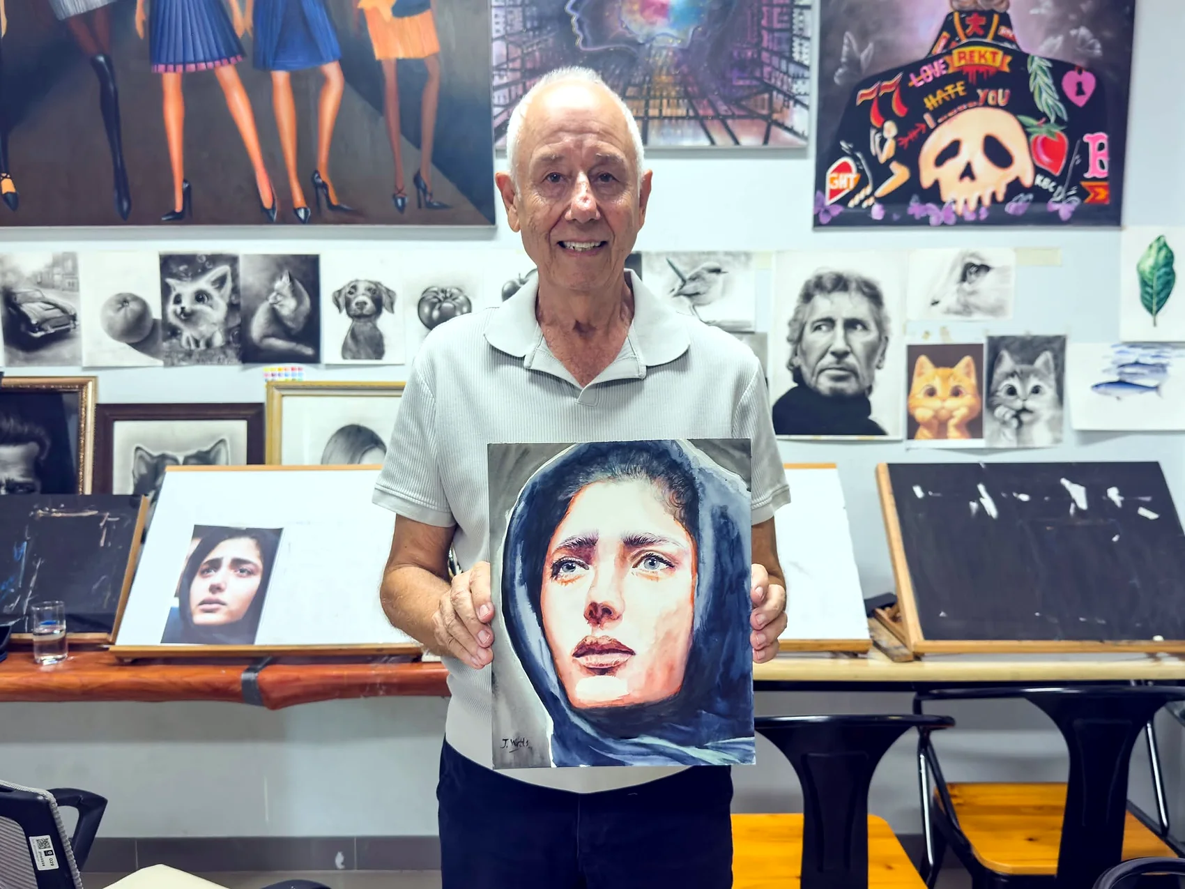 Older adult learner presenting a finished portrait