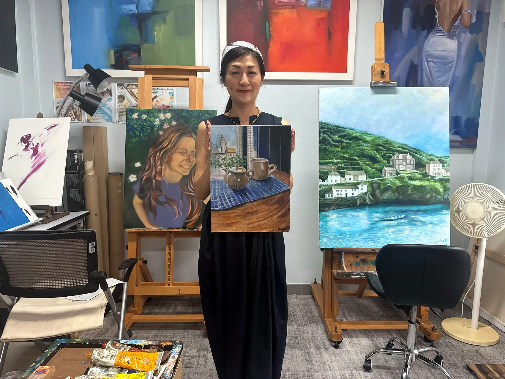 Adult learner presenting a still-life painting